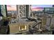 Building with an outdoor space featuring black metal stairs, seating area, and an incredible view of the city at dusk at 90 Fairlie Street Nw #801 # 801, Atlanta, GA 30303