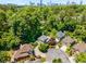 Aerial view of the property showcasing its location amongst mature trees, lush greenery, and cul-de-sac at 1077 Shady Valley Ne Pl, Atlanta, GA 30324