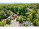 Aerial view of the property showcasing its location amongst mature trees, lush greenery, and a nearby cul-de-sac at 1077 Shady Valley Ne Pl, Atlanta, GA 30324