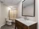 Clean bathroom featuring a shower with sliding glass doors, neutral walls, and modern vanity with sink at 1077 Shady Valley Ne Pl, Atlanta, GA 30324