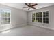 Bright bedroom with large windows providing natural light and views of the surrounding greenery at 1077 Shady Valley Ne Pl, Atlanta, GA 30324