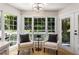 Breakfast room features a seating area with chairs, a view of the outside, and a glass door at 1077 Shady Valley Ne Pl, Atlanta, GA 30324