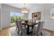 Elegant dining room features stylish decor, large window and a modern chandelier at 1077 Shady Valley Ne Pl, Atlanta, GA 30324