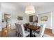 Elegant dining room features stylish decor, a modern chandelier, and views to other rooms at 1077 Shady Valley Ne Pl, Atlanta, GA 30324