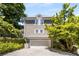 Attached two-car garage with ample driveway space and mature trees at 1077 Shady Valley Ne Pl, Atlanta, GA 30324
