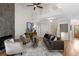 Open-concept living room with stone fireplace and a view of the upper level at 1077 Shady Valley Ne Pl, Atlanta, GA 30324