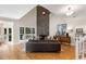 Grand living room boasts a soaring ceiling, stone fireplace, and ample natural light at 1077 Shady Valley Ne Pl, Atlanta, GA 30324