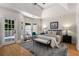 Spacious main bedroom boasts hardwood floors, natural light, and access to a private patio at 1077 Shady Valley Ne Pl, Atlanta, GA 30324