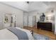 Main bedroom boasts hardwood floors, a tray ceiling, and a view to the Primary bath at 1077 Shady Valley Ne Pl, Atlanta, GA 30324