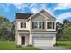 Charming two-story home featuring a brick facade, attached two-car garage, and meticulously manicured lawn at 1315 Elowen Dr, Austell, GA 30168