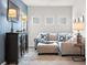 Comfortable living room with a large couch, stylish decor and carpet at 1315 Elowen Dr, Austell, GA 30168