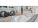 Spacious main bedroom with a neutral color palette, plush carpet, and comfortable seating area for relaxation at 1315 Elowen Dr, Austell, GA 30168