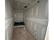 Compact bathroom featuring newly installed drywall, a tub-shower combo ready for finishing and personalization at 2076 Boxwood Circle Se, Conyers, GA 30094