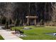 Outdoor recreation area with bocce ball court, cornhole, benches and wooded backdrop at 2076 Boxwood Circle Se, Conyers, GA 30094