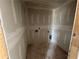 Compact laundry room featuring new drywall, complete with essential connections for a modern and efficient setup at 2076 Boxwood Circle Se, Conyers, GA 30094