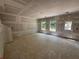 Open concept living room with a door to outside and large windows, with neutral tones at 2076 Boxwood Circle Se, Conyers, GA 30094