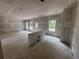 Bright, unfinished living room with a view and access to outside, ready to be designed at 2076 Boxwood Circle Se, Conyers, GA 30094
