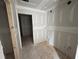 Well-lit room, freshly drywalled, awaiting your creative vision and finishing touches for the perfect space at 2076 Boxwood Circle Se, Conyers, GA 30094