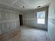 Bright room with window, featuring smooth, freshly installed drywall and ample natural light potential at 2076 Boxwood Circle Se, Conyers, GA 30094