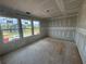 Bright room with large windows, featuring newly drywalled walls, offering a blank canvas for customization at 2076 Boxwood Circle Se, Conyers, GA 30094