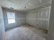 Bright room with window, featuring smooth, freshly installed drywall and ample natural light potential at 2076 Boxwood Circle Se, Conyers, GA 30094
