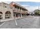 View of commercial buildings along a street with parking at 2076 Boxwood Circle Se, Conyers, GA 30094