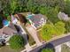 Aerial view of the home featuring a private pool, lush greenery, mature trees, and a long driveway at 679 Gold Valley Pass, Canton, GA 30114