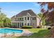 Beautiful home exterior with a swimming pool, gazebo, and landscaped yard, perfect for outdoor living and entertaining at 679 Gold Valley Pass, Canton, GA 30114