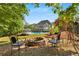 Backyard with a fire pit, pool, and gazebo, ideal for entertaining friends and Gathering outdoors at 679 Gold Valley Pass, Canton, GA 30114
