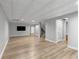 Spacious finished basement featuring wood-look flooring, recessed lighting, and access to the upper levels via staircase at 679 Gold Valley Pass, Canton, GA 30114