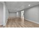 Spacious basement area featuring stylish flooring, a tiled ceiling with recessed lighting, and an open layout at 679 Gold Valley Pass, Canton, GA 30114