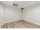 Unfinished basement area with stylish wood-look floors and tiled ceiling with recessed lights at 679 Gold Valley Pass, Canton, GA 30114