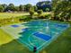 Outdoor basketball court surrounded by lush greenery and play equipment at 679 Gold Valley Pass, Canton, GA 30114