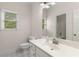Bathroom featuring a sink with natural lighting and white tile floors at 679 Gold Valley Pass, Canton, GA 30114