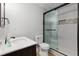 Beautiful bathroom featuring a glass shower with subway tile, a dark wood vanity, and modern fixtures at 679 Gold Valley Pass, Canton, GA 30114