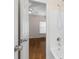 Bathroom featuring white tile floors, shower and hardwood flooring in the background at 679 Gold Valley Pass, Canton, GA 30114