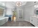 Bright bathroom features a marble countertop vanity and a modern soaking tub at 679 Gold Valley Pass, Canton, GA 30114
