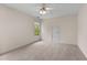 Neutral bedroom with carpet flooring, ceiling fan, and one window offering plenty of natural light at 679 Gold Valley Pass, Canton, GA 30114