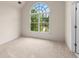 Comfortable bedroom with neutral carpet and arched window providing natural light at 679 Gold Valley Pass, Canton, GA 30114