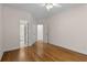 Bedroom featuring hardwood floors and access to the bathroom at 679 Gold Valley Pass, Canton, GA 30114