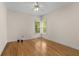 Cozy bedroom featuring hardwood floors and a window letting in natural light at 679 Gold Valley Pass, Canton, GA 30114