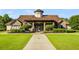 Inviting stone clubhouse with manicured landscaping and a welcoming entrance for community gatherings and events at 679 Gold Valley Pass, Canton, GA 30114