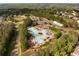 Aerial view showcasing a large, resort-style community pool, water slides, and amenities at 679 Gold Valley Pass, Canton, GA 30114