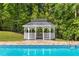 Charming gazebo situated near the swimming pool and lush greenery, perfect for relaxing and enjoying the outdoors at 679 Gold Valley Pass, Canton, GA 30114