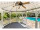 Inside a gazebo overlooking the pool and backyard, featuring a ceiling fan and ample shade for relaxing outdoors at 679 Gold Valley Pass, Canton, GA 30114