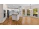 Spacious kitchen with white cabinetry, granite countertops, stainless steel appliances, and a breakfast nook at 679 Gold Valley Pass, Canton, GA 30114