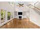 Spacious living room features a fireplace, built-in bookshelves, hardwood floors, and abundant natural light at 679 Gold Valley Pass, Canton, GA 30114