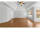 Bright main bedroom featuring hardwood floors and a trey ceiling, creating an airy retreat at 679 Gold Valley Pass, Canton, GA 30114