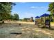 Colorful playground with slides, swings, and climbing structures, offering a fun and safe play area for children at 679 Gold Valley Pass, Canton, GA 30114