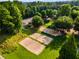 Aerial view of sand volleyball courts surrounded by lush greenery in a residential community at 679 Gold Valley Pass, Canton, GA 30114